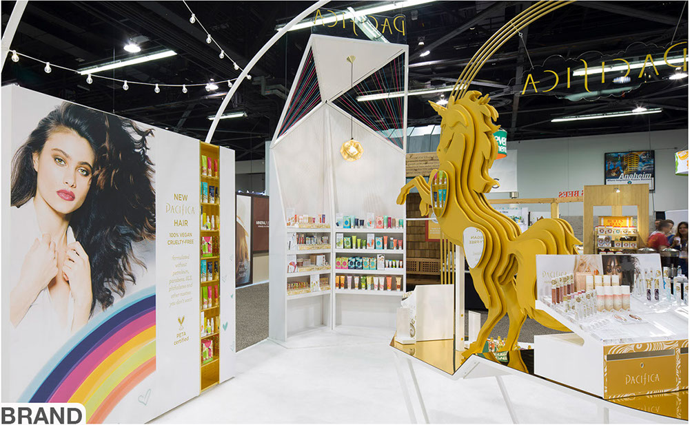 An image of Turn Pacifica trade show booth with gold unicorn